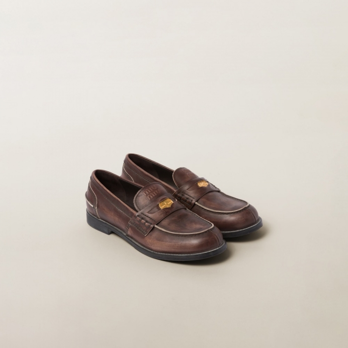 Miu Miu Vintage-effect leather penny loafers Ebony