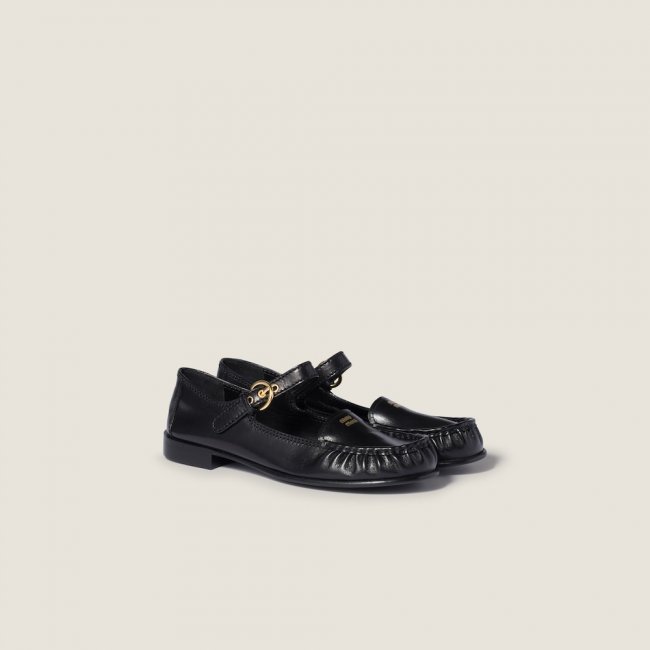 Miu Miu Leather loafers with strap Black