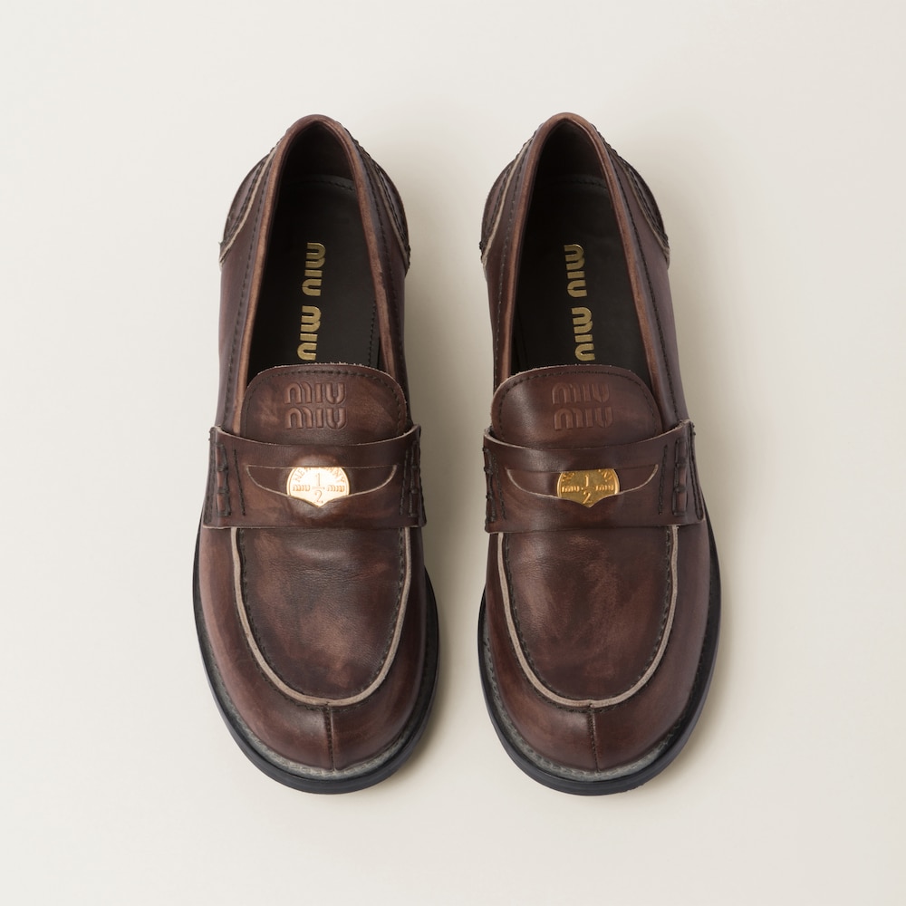 Miu Miu Vintage-effect leather penny loafers Ebony
