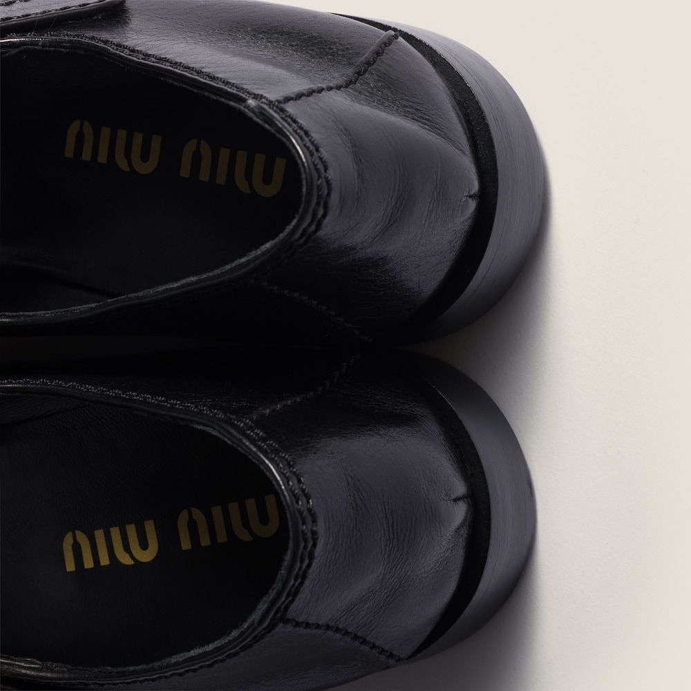 Miu Miu Leather loafers with strap Black