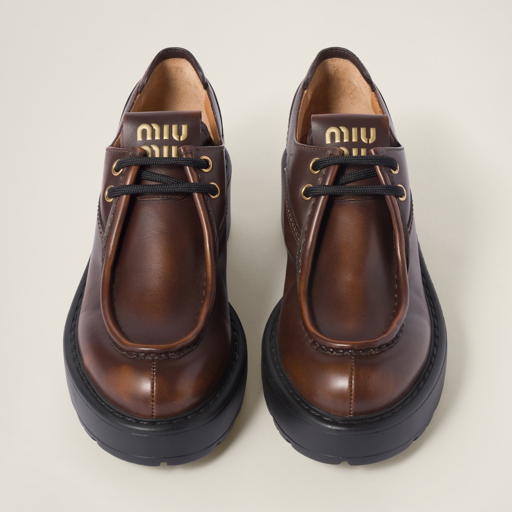 Miu Miu Laced fumé leather shoes Sienna